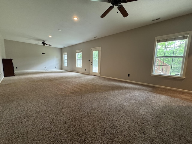 carpeted empty room featuring a ceiling fan, baseboards, and recessed lighting