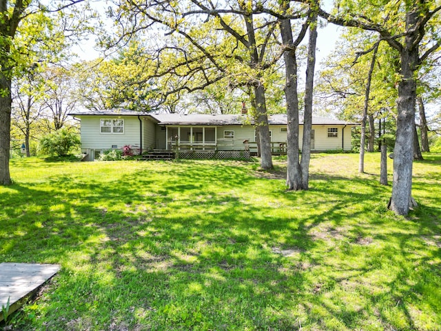 10155 E Union Church Rd, Centralia, MO 65240 - rear view of house featuring a lawn and a wooden deck