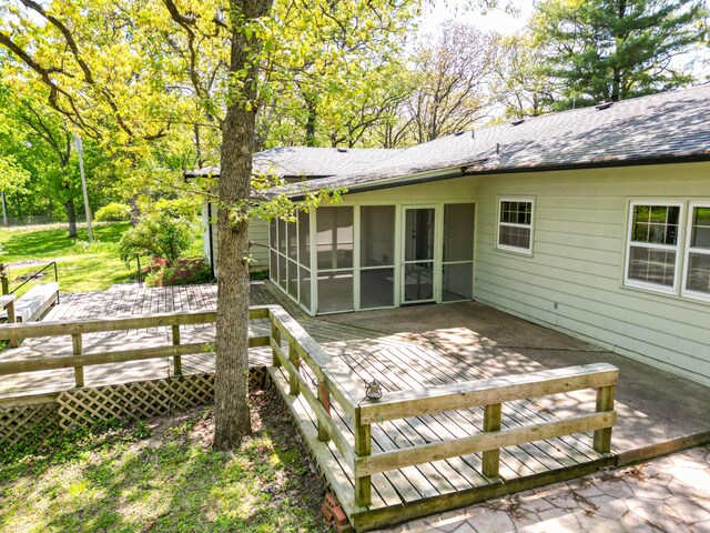 10155 E Union Church Rd, Centralia, MO 65240 - back of property with a deck, a sunroom, and roof with shingles