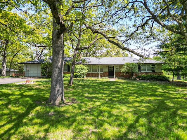 10155 E Union Church Rd, Centralia, MO 65240 - ranch-style home with driveway, a front yard, brick siding, and an attached garage