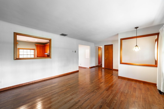 10155 E Union Church Rd, Centralia, MO 65240 - spare room featuring dark wood-style floors and baseboards