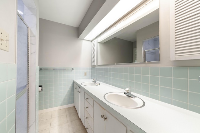 10155 E Union Church Rd, Centralia, MO 65240 - full bath with tile patterned flooring, tile walls, double vanity, a shower, and a wainscoted wall