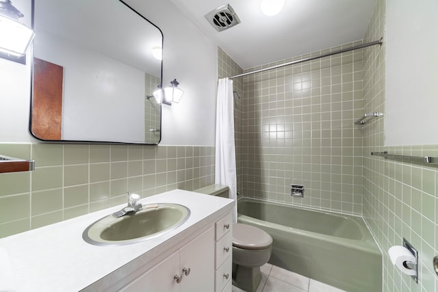 10155 E Union Church Rd, Centralia, MO 65240 - full bathroom featuring shower / bath combination with curtain, tile patterned floors, toilet, tile walls, and vanity