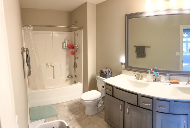full bath with toilet, double vanity, bathing tub / shower combination, and marble look tiles