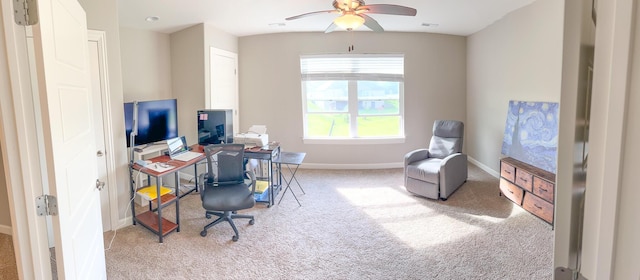office area with carpet floors, baseboards, and ceiling fan