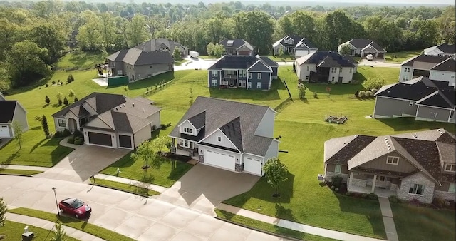 aerial view of residential area with a heavily wooded area
