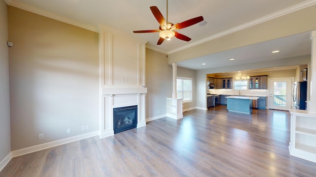 5492 Diversey Rdg, Columbia, MO 65203 - unfurnished living room with ceiling fan, crown molding, dark wood finished floors, a fireplace, and recessed lighting