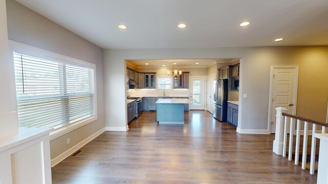 5492 Diversey Rdg, Columbia, MO 65203 - kitchen with appliances with stainless steel finishes, a chandelier, recessed lighting, light countertops, and a kitchen island