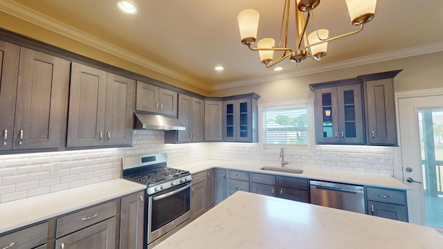 5492 Diversey Rdg, Columbia, MO 65203 - kitchen with appliances with stainless steel finishes, under cabinet range hood, healthy amount of natural light, light countertops, and crown molding