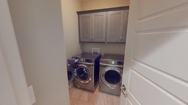 5492 Diversey Rdg, Columbia, MO 65203 - laundry room featuring independent washer and dryer, cabinet space, and light tile patterned floors