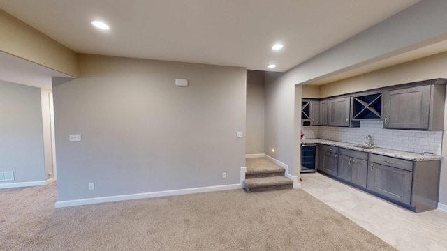 5492 Diversey Rdg, Columbia, MO 65203 - bar featuring light carpet, recessed lighting, tasteful backsplash, and stairway