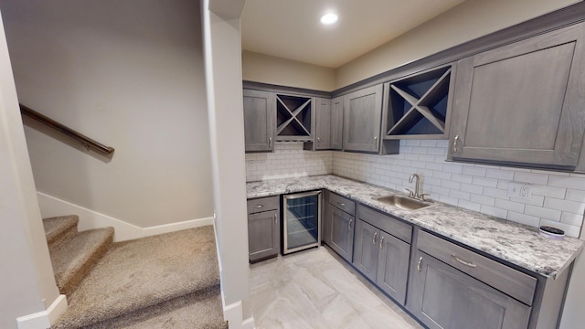 5492 Diversey Rdg, Columbia, MO 65203 - bar with wine cooler, backsplash, stairs, light marble finish floors, and recessed lighting