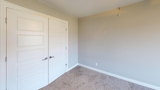 5492 Diversey Rdg, Columbia, MO 65203 - unfurnished bedroom with carpet flooring and a closet