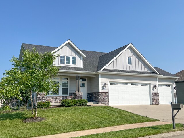 5492 Diversey Rdg, Columbia, MO 65203 - craftsman house featuring board and batten siding, covered porch, a front lawn, and stone siding