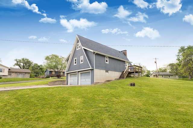 view of property exterior featuring a garage, driveway, stairway, a shingled roof, and a yard