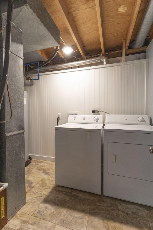 laundry room featuring washing machine and clothes dryer