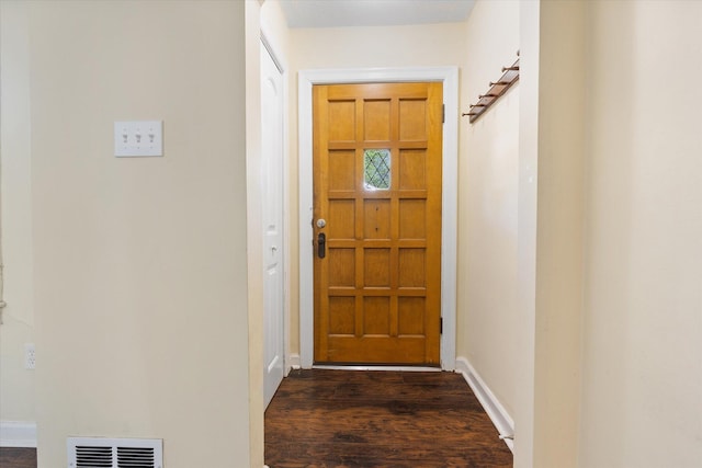 doorway to outside with dark wood-style floors and baseboards