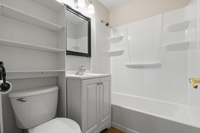 bathroom with toilet,  shower combination, and vanity
