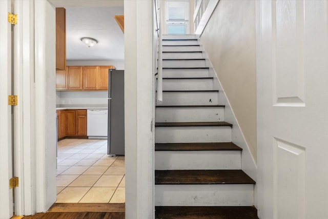 stairway featuring tile patterned floors