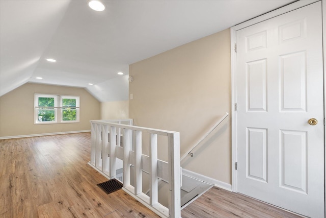 bonus room featuring wood finished floors, recessed lighting, lofted ceiling, and baseboards