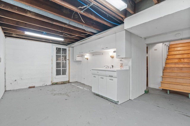 unfinished basement featuring stairway