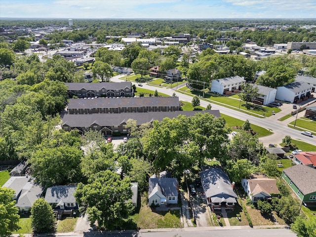 aerial perspective of suburban area with a tree filled landscape