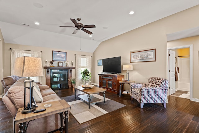 living area featuring vaulted ceiling, a ceiling fan, recessed lighting, baseboards, and wood finished floors