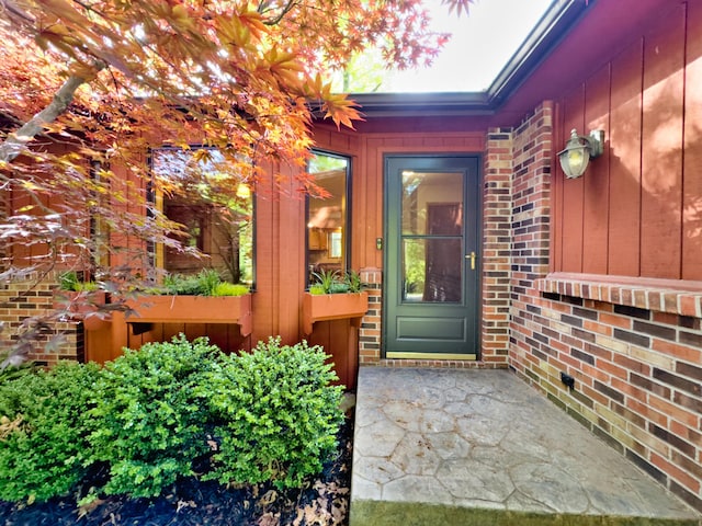 property entrance with brick siding