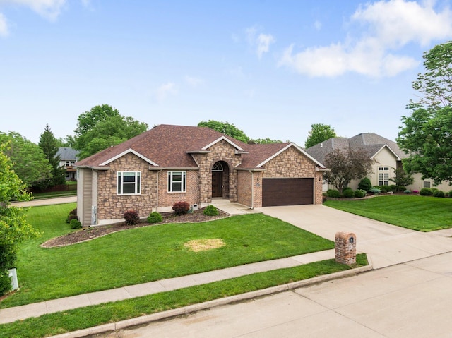 view of front of property with a garage, stone siding, a front yard, driveway, and a shingled roof