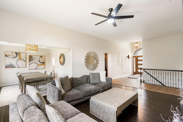 living room with ceiling fan, hardwood / wood-style flooring, and baseboards