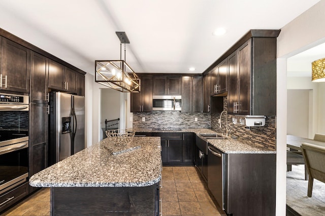 kitchen with appliances with stainless steel finishes, dark brown cabinetry, tasteful backsplash, light stone counters, and recessed lighting