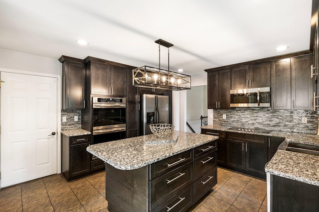 kitchen featuring stainless steel appliances, decorative backsplash, dark brown cabinetry, dark tile patterned floors, and recessed lighting