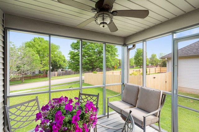 sunroom featuring plenty of natural light and ceiling fan