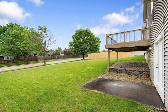 view of yard featuring a wooden deck