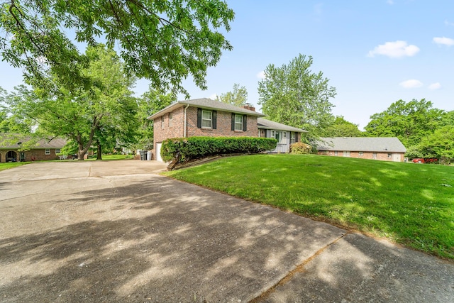 4 Halley Ct, Fulton, MO 65251 - split level home with a chimney, a front yard, brick siding, concrete driveway, and a garage