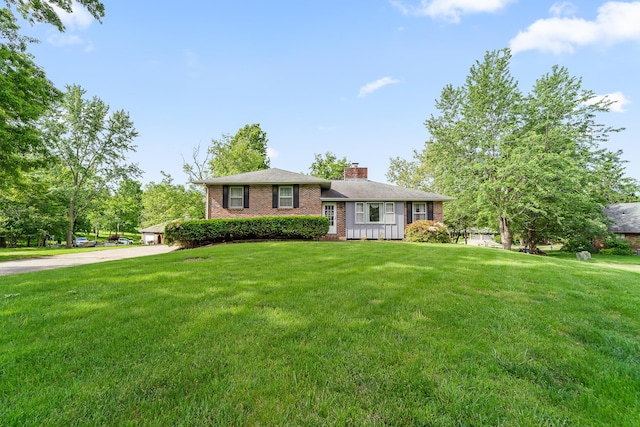 4 Halley Ct, Fulton, MO 65251 - tri-level home with brick siding, a chimney, and a front lawn
