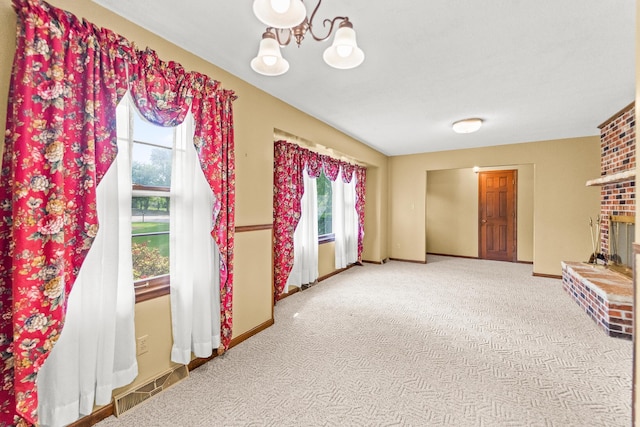 4 Halley Ct, Fulton, MO 65251 - unfurnished living room with a chandelier, baseboards, carpet flooring, and a brick fireplace