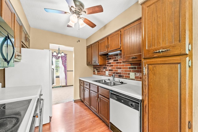 4 Halley Ct, Fulton, MO 65251 - kitchen with a sink, dishwasher, light countertops, light wood-style flooring, and backsplash