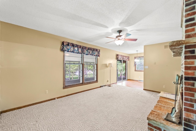 4 Halley Ct, Fulton, MO 65251 - unfurnished living room featuring carpet, a ceiling fan, baseboards, and a textured ceiling
