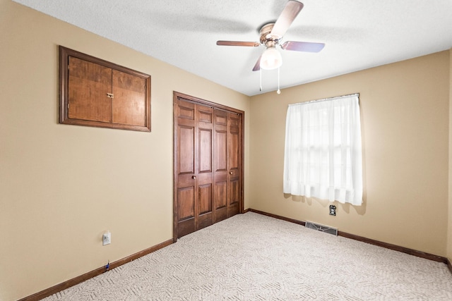 4 Halley Ct, Fulton, MO 65251 - unfurnished bedroom featuring baseboards, carpet flooring, a closet, and ceiling fan