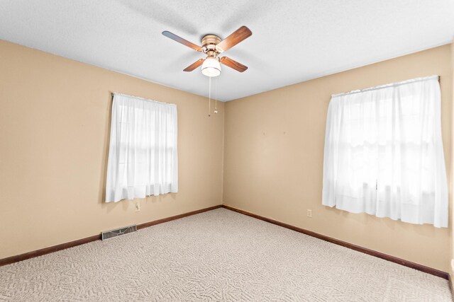 4 Halley Ct, Fulton, MO 65251 - carpeted spare room with ceiling fan and baseboards