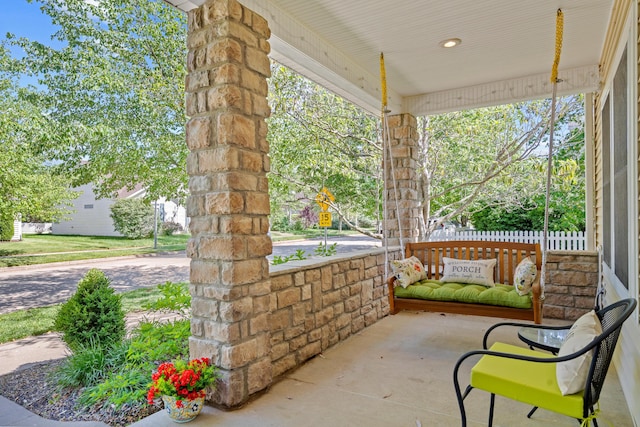 view of patio featuring a porch