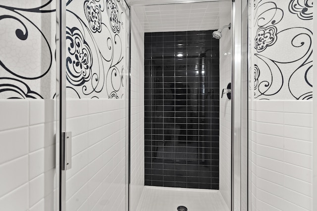 bathroom featuring a shower stall