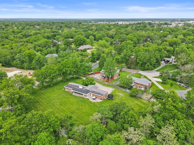aerial overview of property's location featuring a forest
