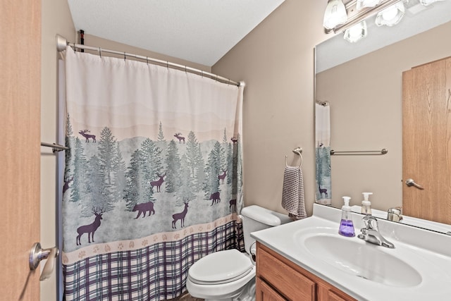 bathroom with toilet, vanity, and a shower with curtain