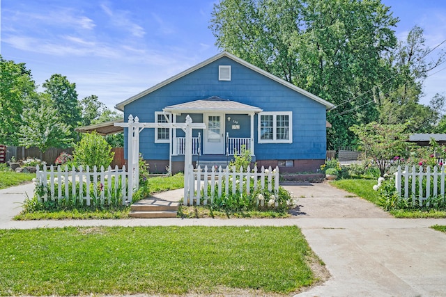 bungalow with concrete driveway and covered porch