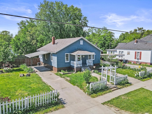 bungalow-style house featuring driveway, covered porch, a carport, a chimney, and a shingled roof