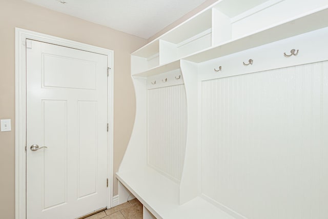 mudroom with light tile patterned floors