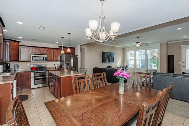 dining space with recessed lighting, ornamental molding, a chandelier, ceiling fan, and light tile patterned flooring
