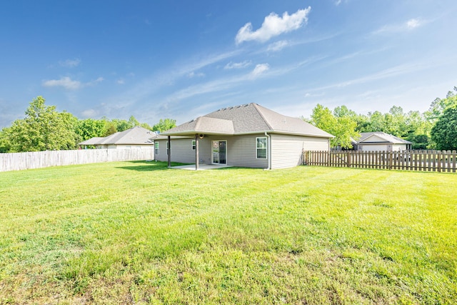 rear view of property featuring a patio area